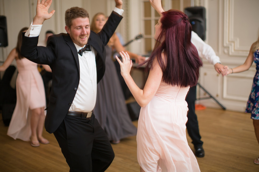 Two people dance at formal event
