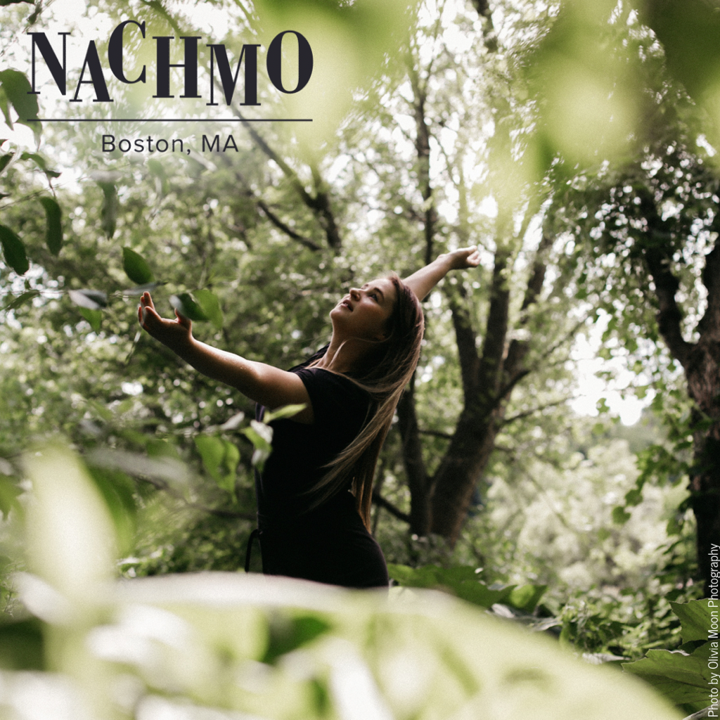 White woman dancing Her arms fully extended Surrounded by trees